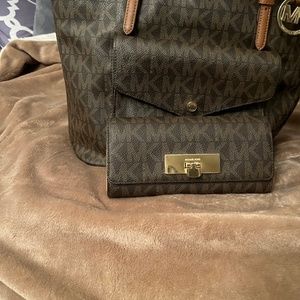 Brown Michael Kors bags and matching wallet.